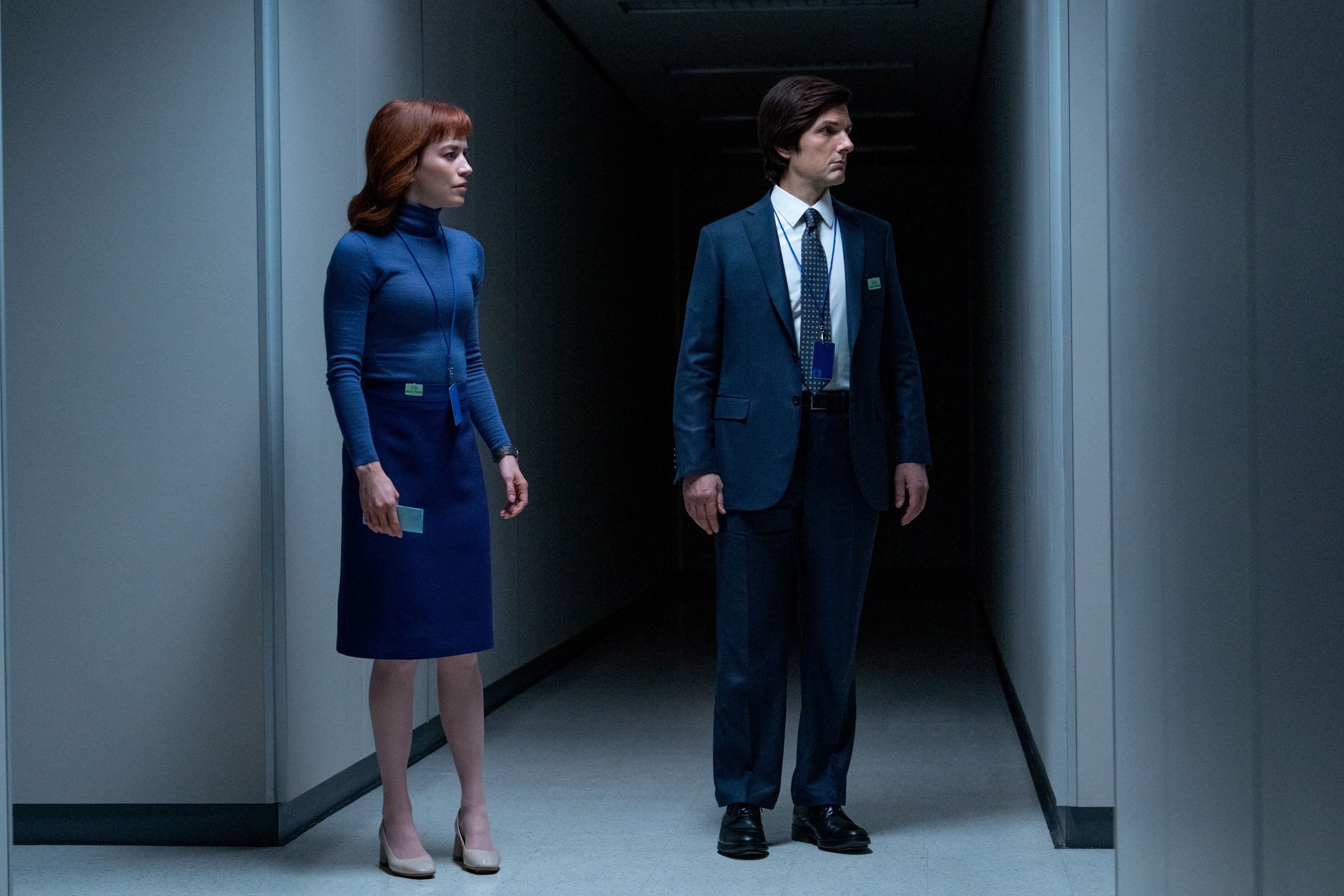 Britt Lower and Adam Scott stand in an office hallway together in Severance season 2.