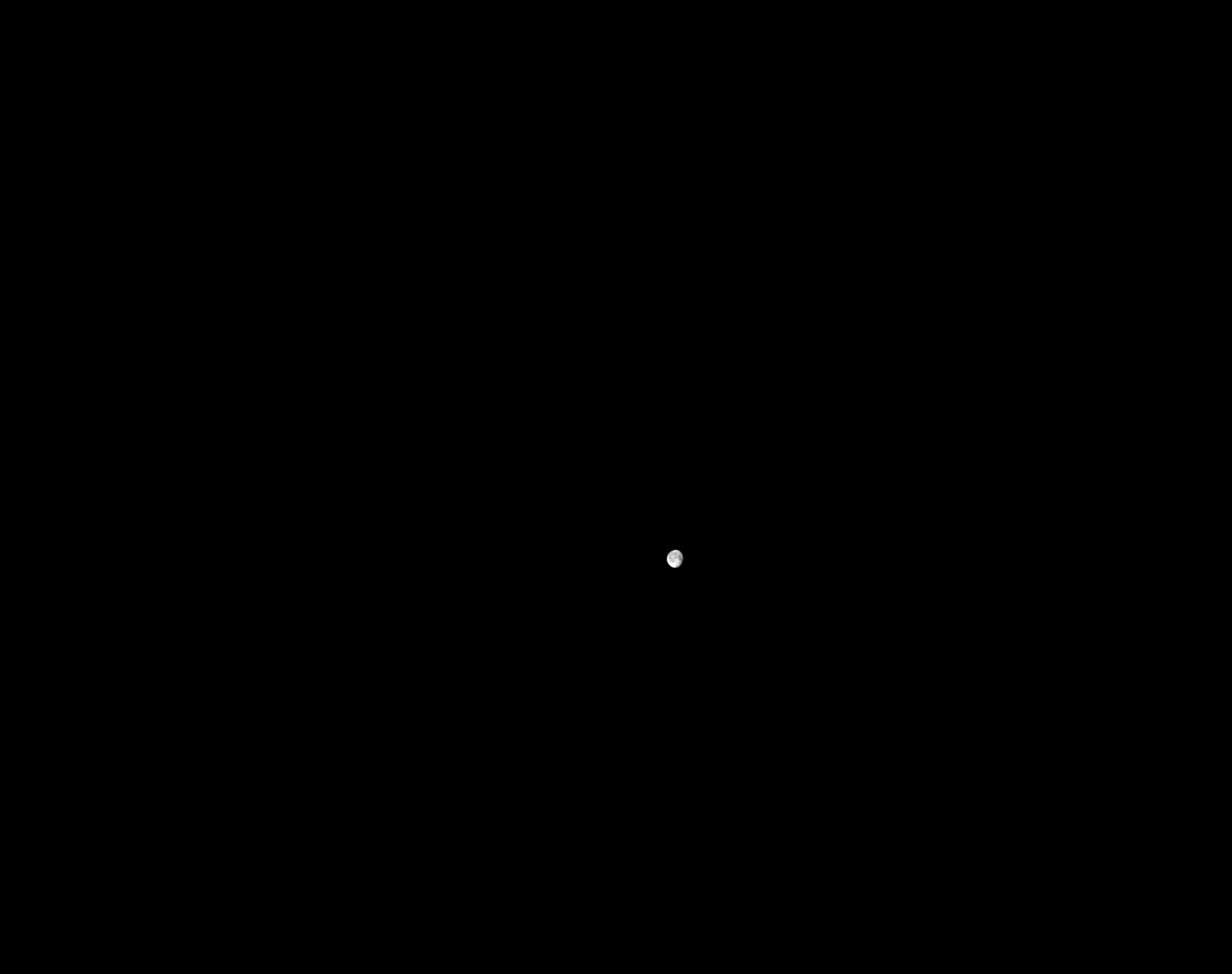 An image of the Moon in the distance taken by Firefly’s Blue Ghost lunar lander while in Earth orbit.