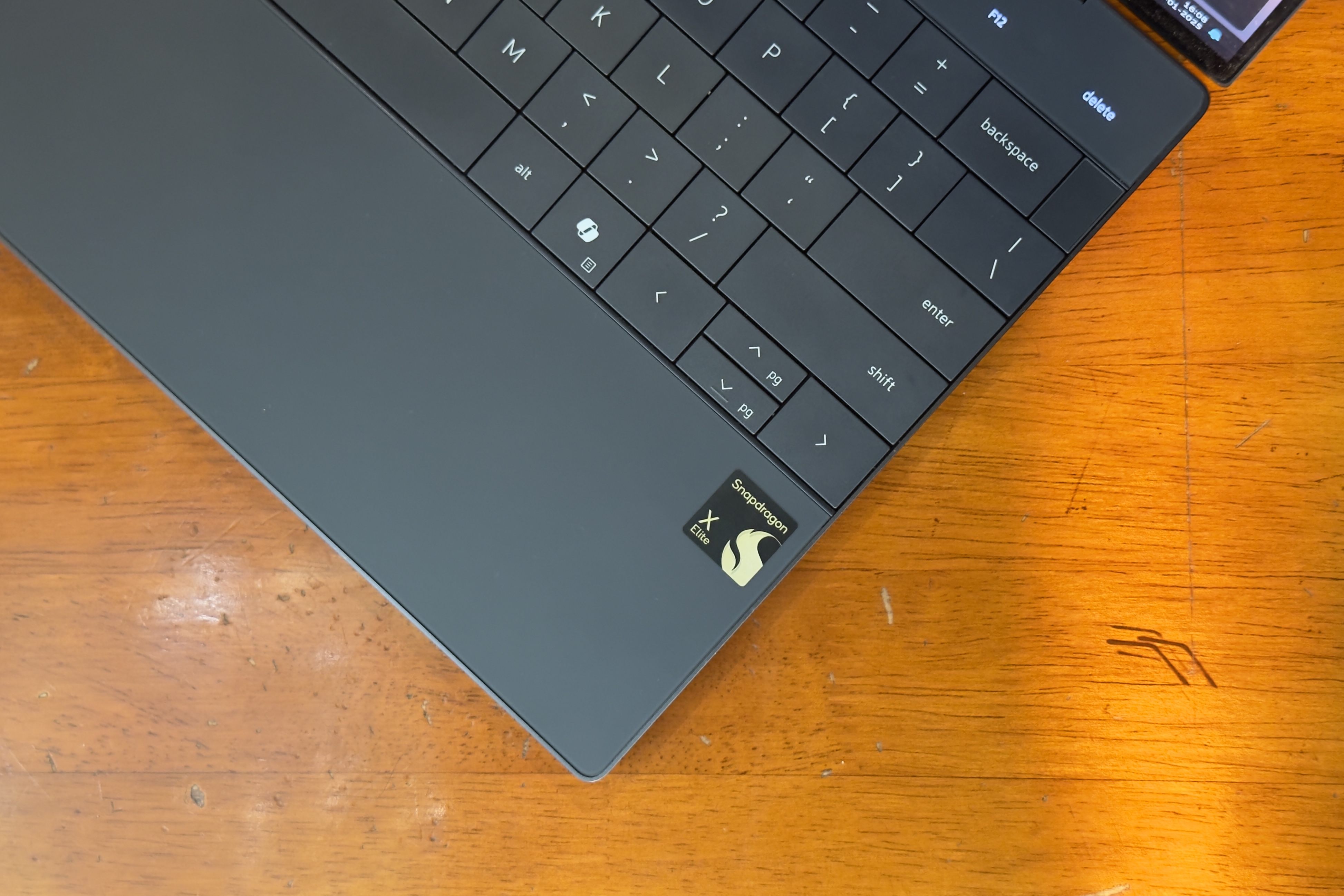 Focus on the silicon logo atop the lid of Dell XPS 13 with Snapdragon X Elite processor.