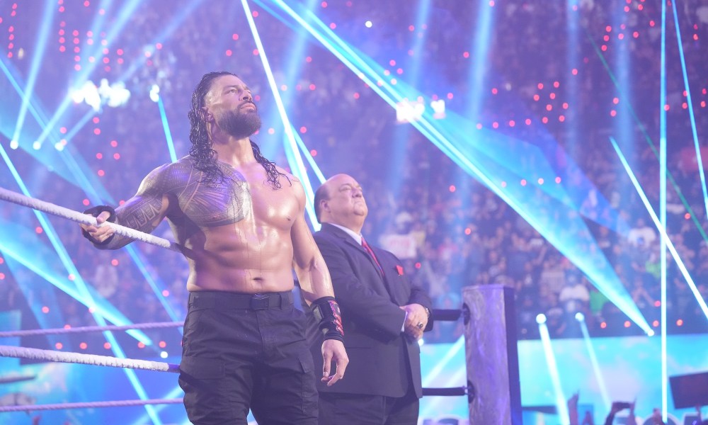 Roman Reigns leans against the ropes at WWE Raw.