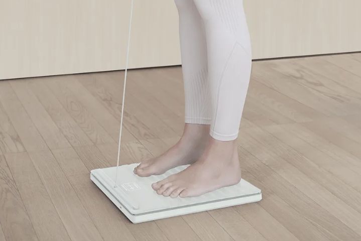 Feet standing on scale