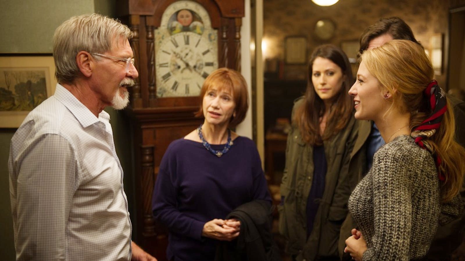 A group of people talk in The Age of Adaline.