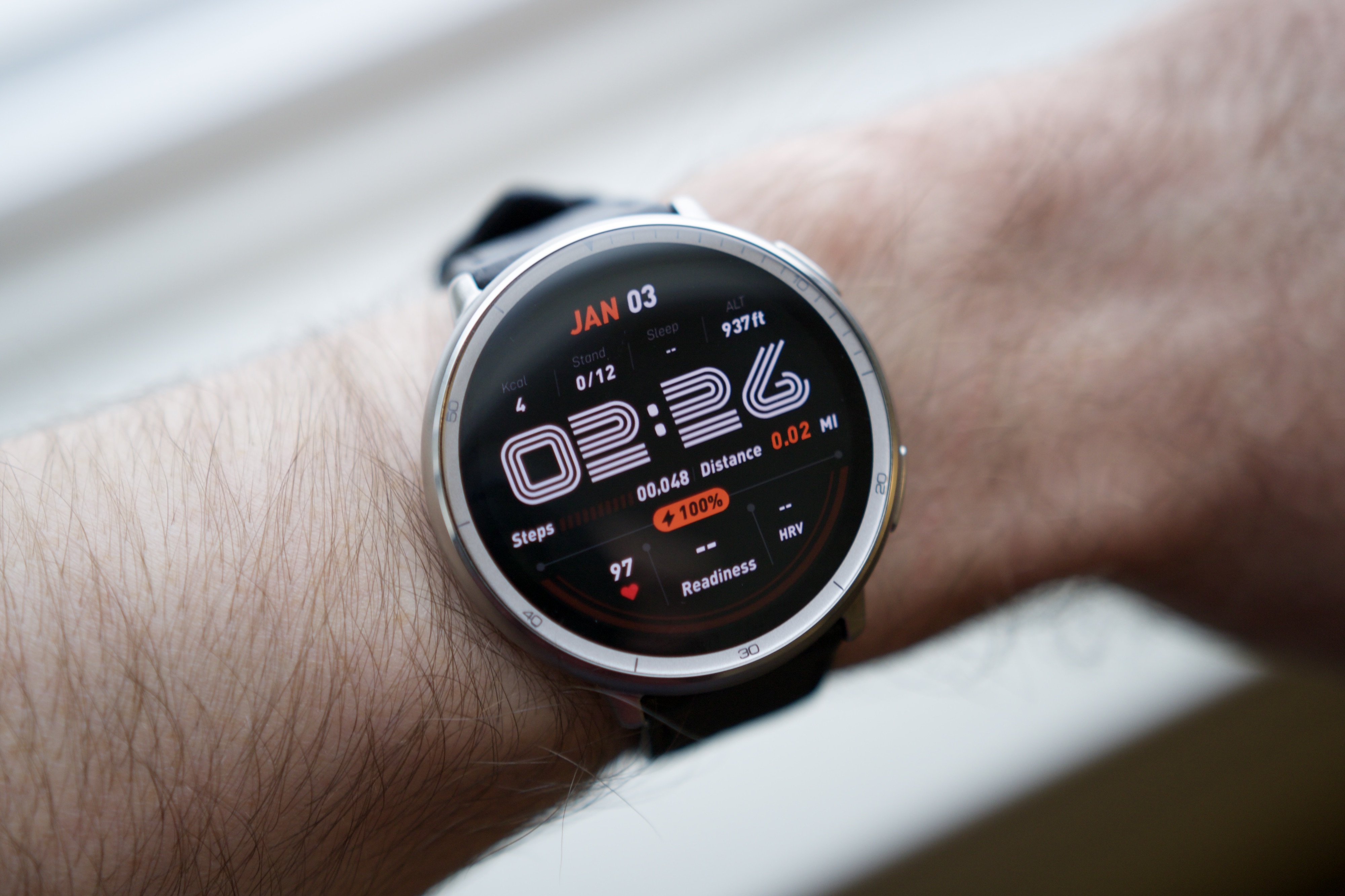 The Amazfit Active 2 on someone's wrist with the screen on.