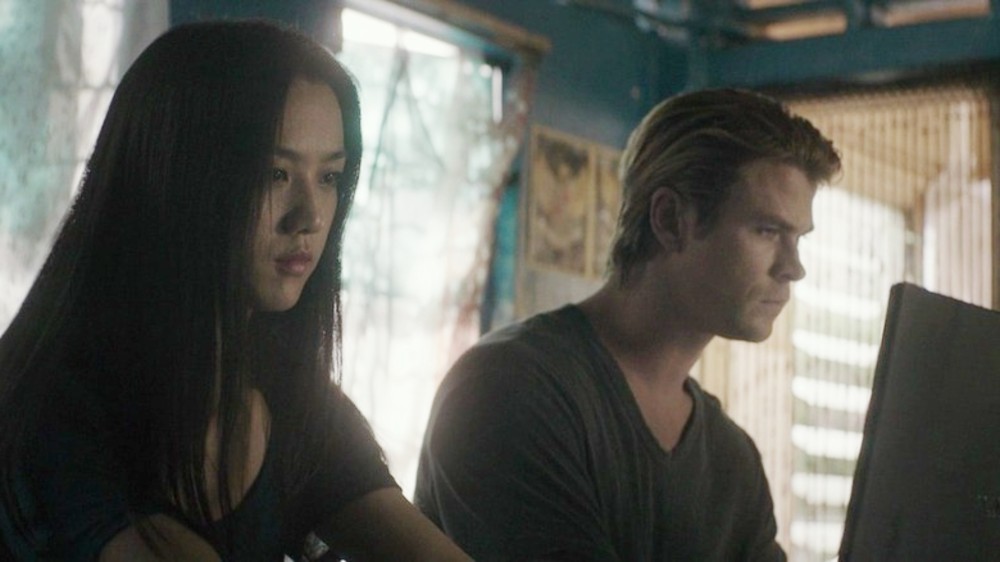 A man and a woman look at their computers in Blackhat.