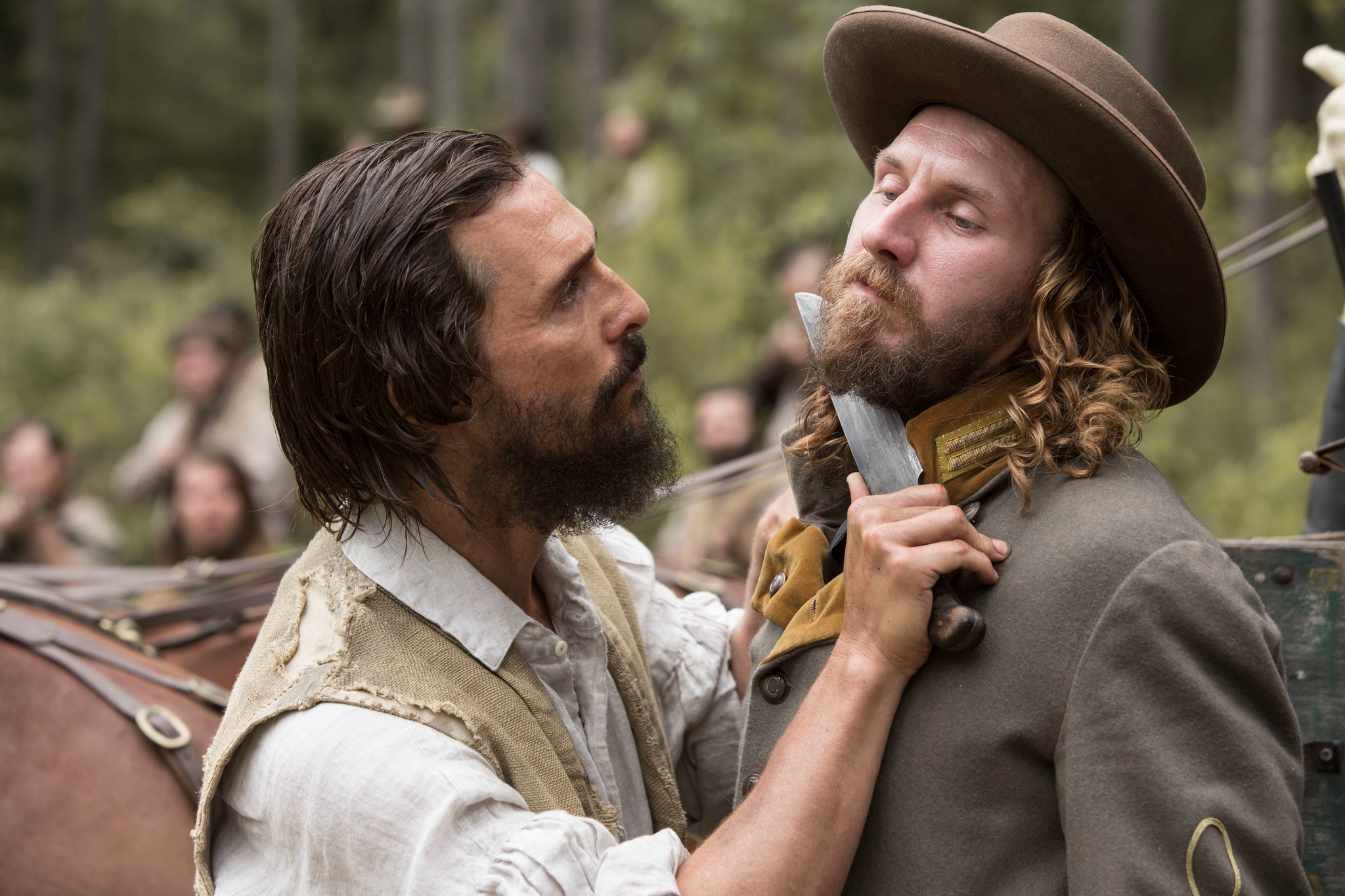 A man holds a knife to another man's throat in Free State of Jones.