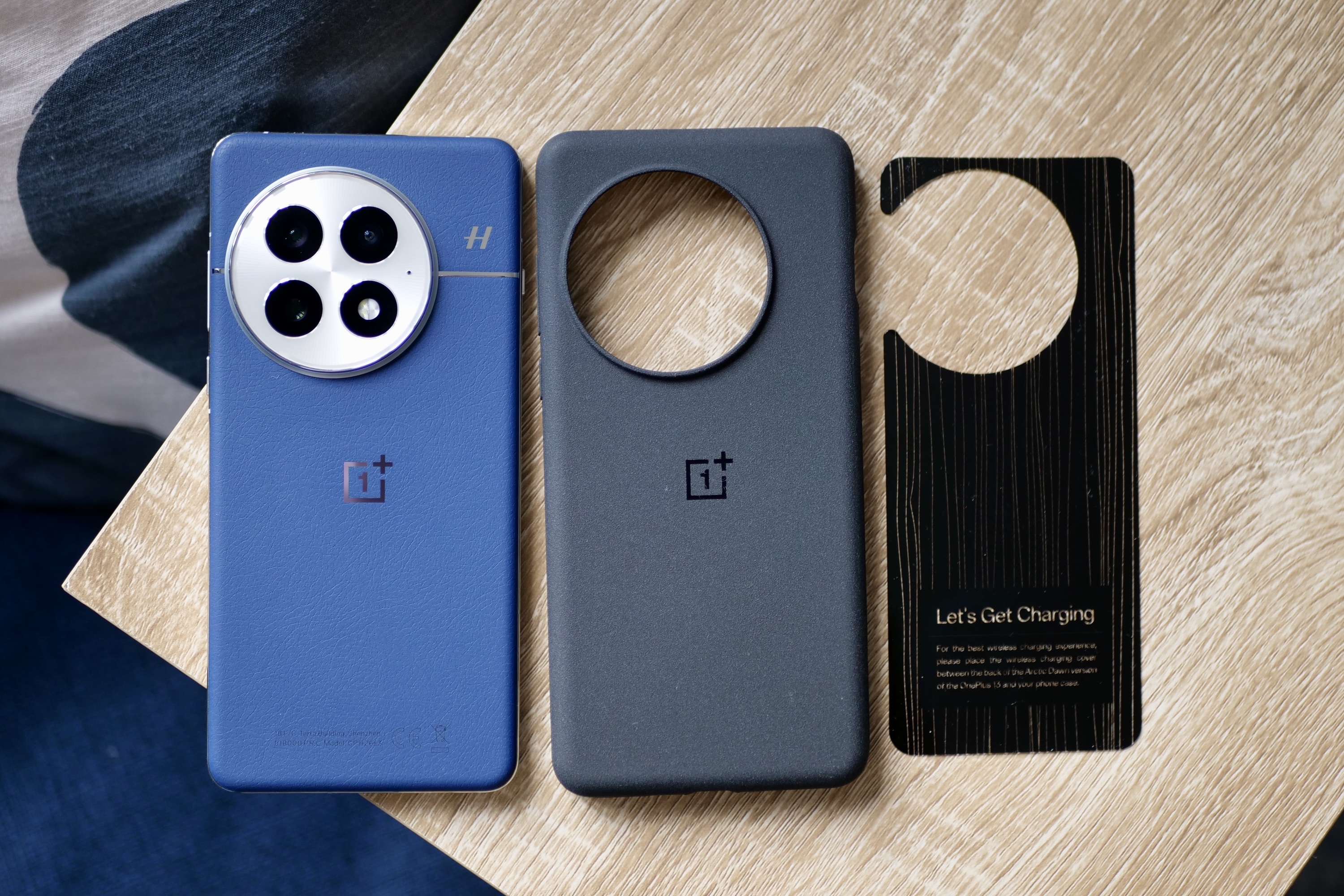 The OnePlus 13 with its Sandstone case.