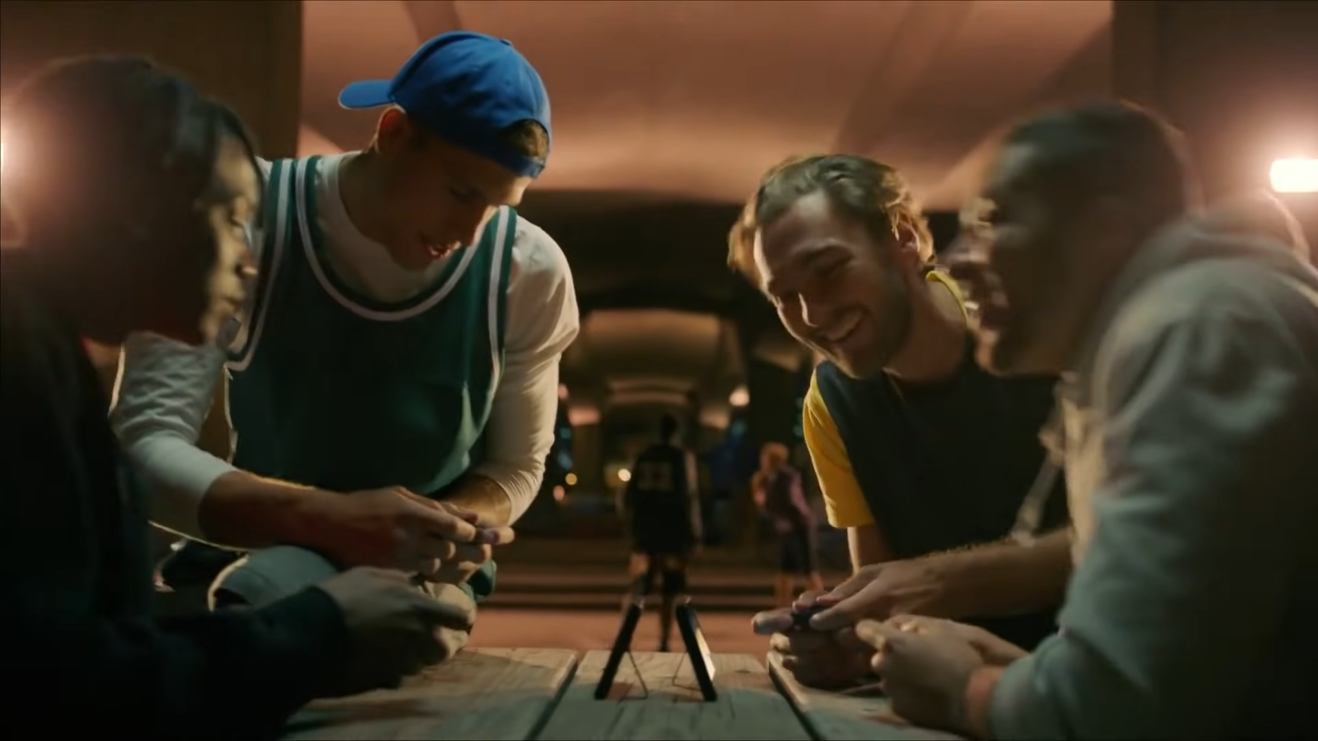 Guys play Nintendo Switch after playing basketball in its reveal trailer.