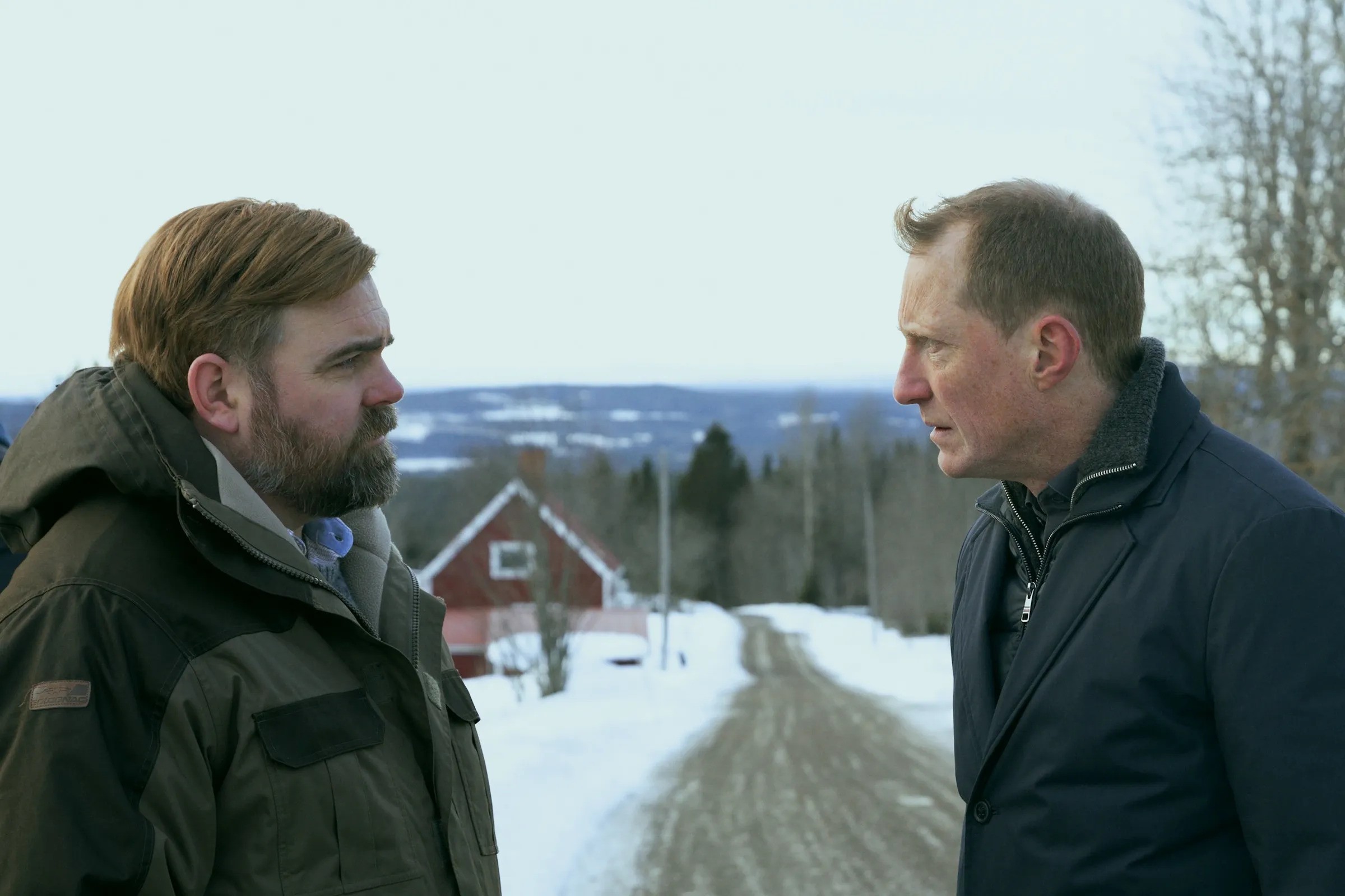 Mattias Nordkvist and Peter Eggers speak on a rural road in The Breakthrough.