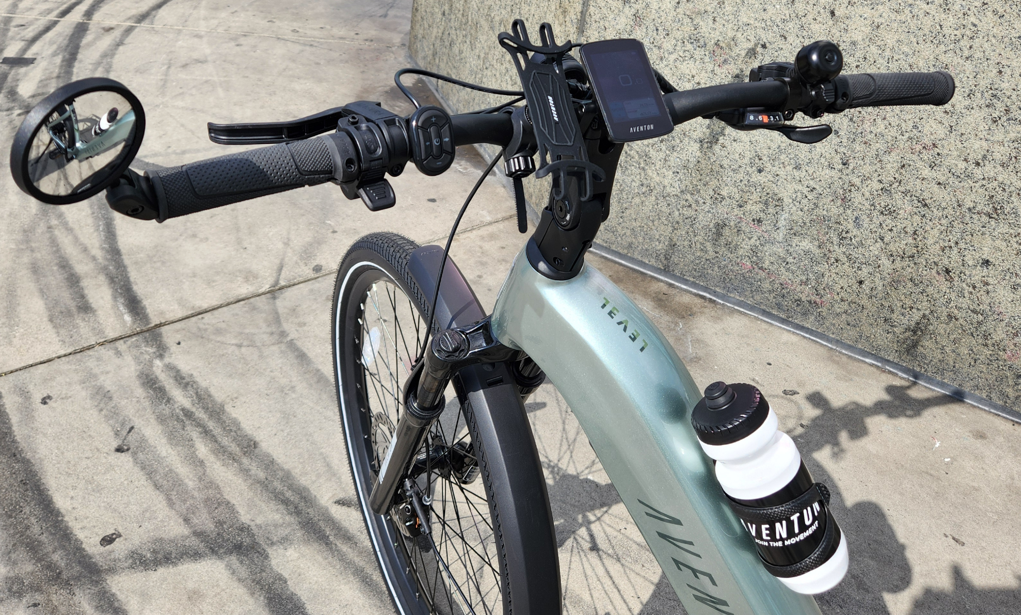 Aventon Level 3 close-up shot of handlebar and rider controls.