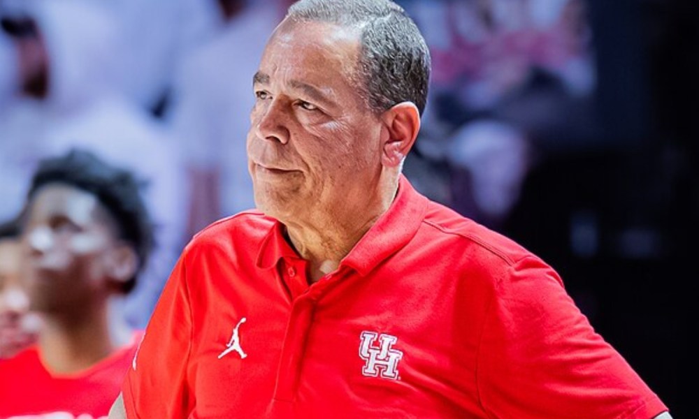 Kelvin Sampson of Houston stands and stares on the sidelines.