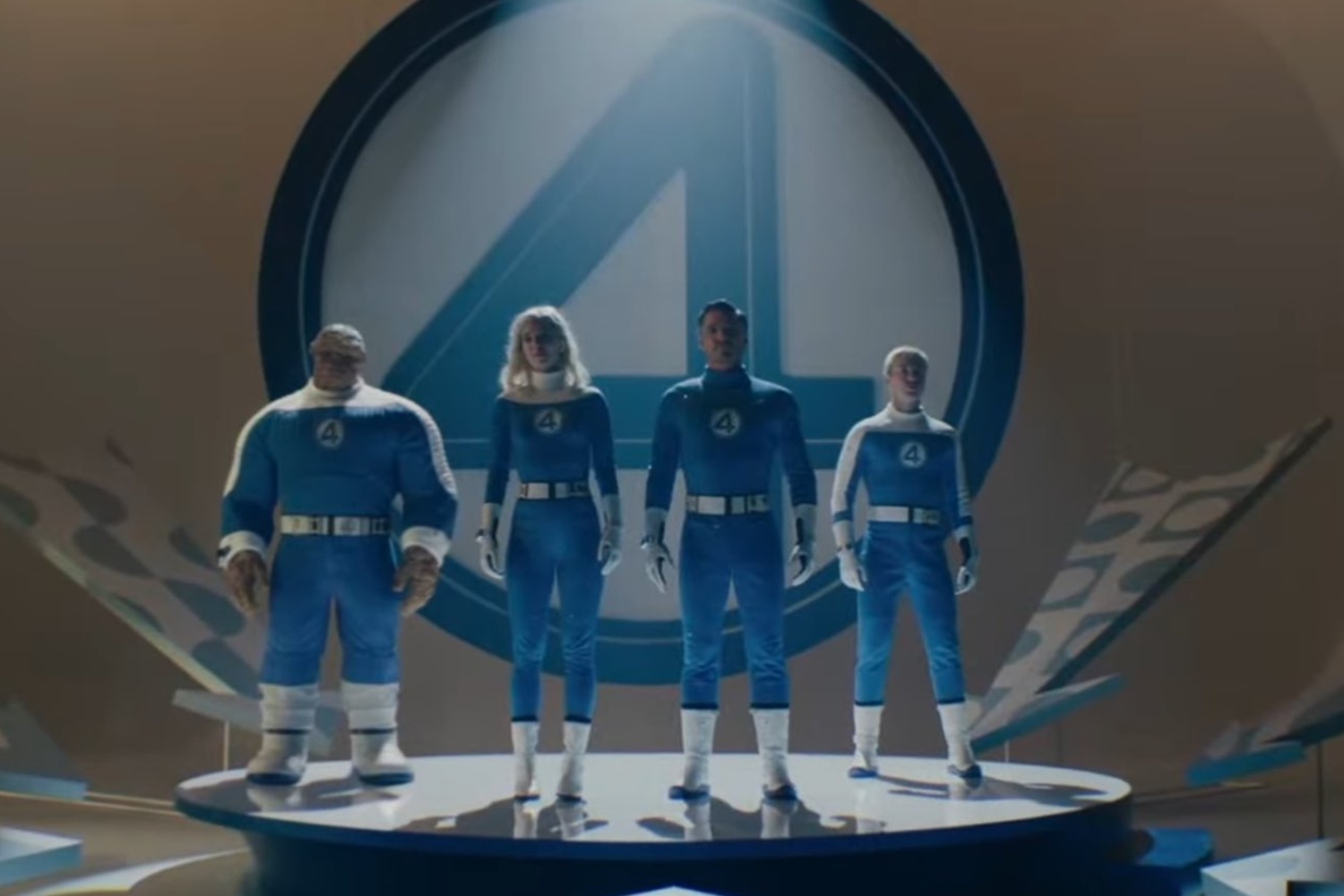 The Fantastic 4 stand on a platform.