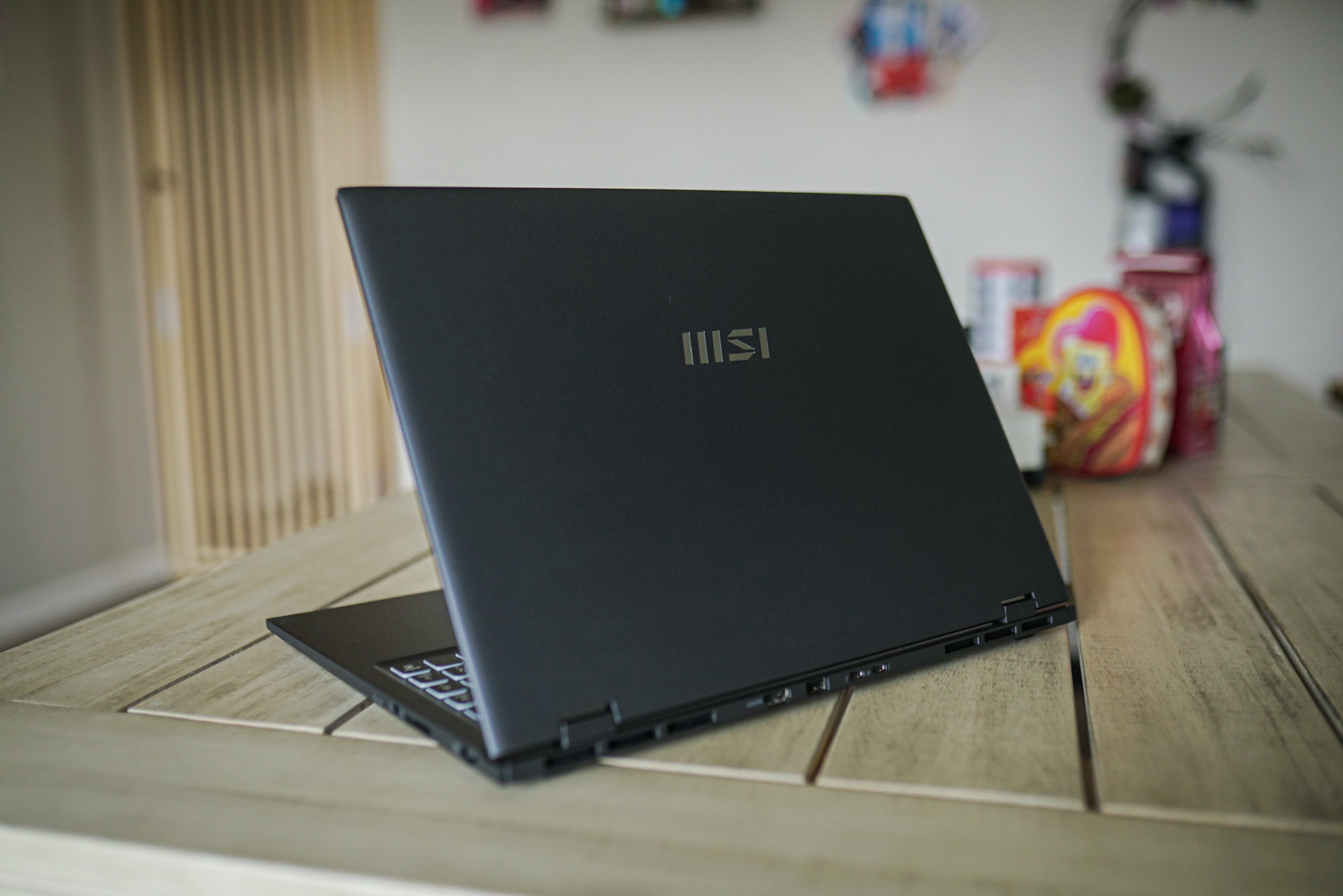 An MSI laptop sitting on a table.