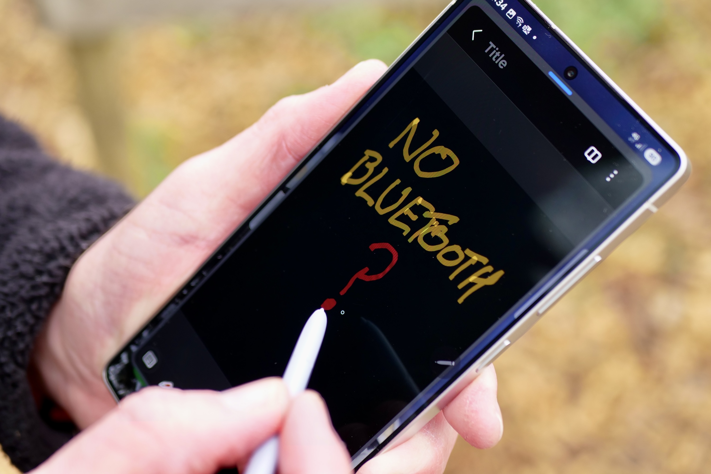 A person using the S Pen stylus on the Samsung Galaxy S25 Ultra.