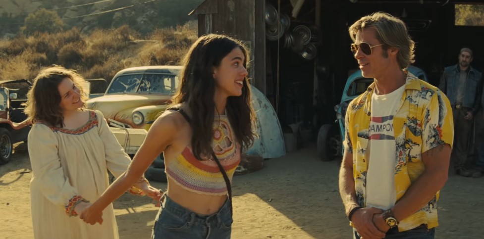 Lena Dunham, Margaret Qualley, and Brad Pitt in Once Upon a Time... in Hollywood.