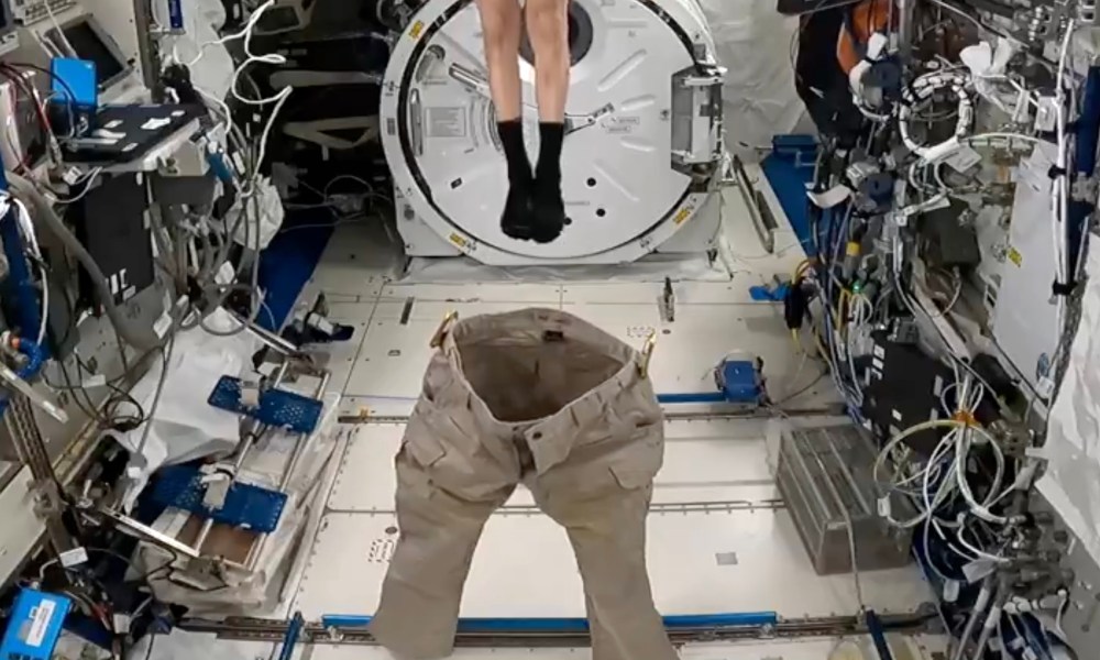 NASA astronaut Don Pettit tries to put on pants without touching them.