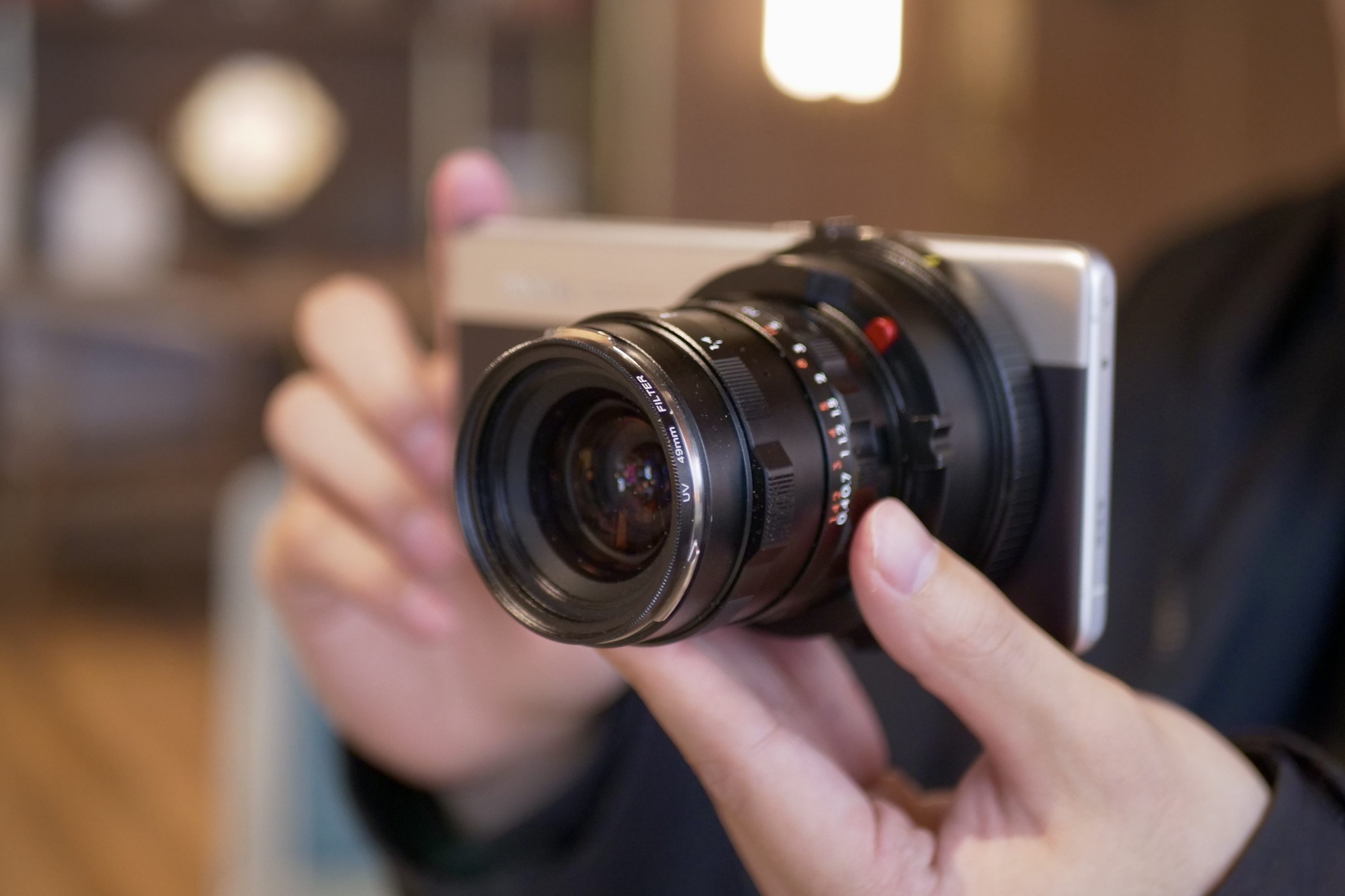 A person holding the Realme Ultra concept phone with the 3x lens.